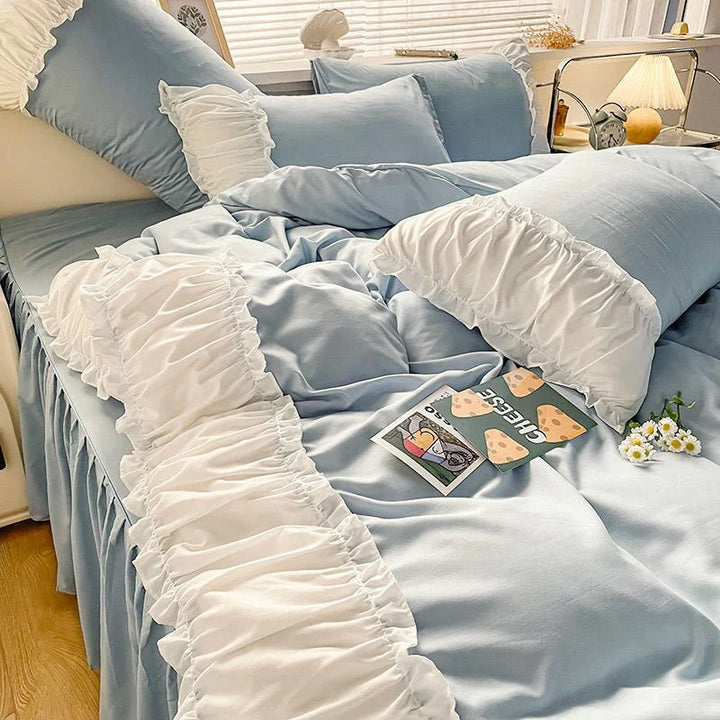 Front left view of the VibeCore Aesthetic Pastel Coquette Duvet Cover Set in pastel blue, showcasing its soft texture and delicate coquette-inspired design for a charming bedroom aesthetic.