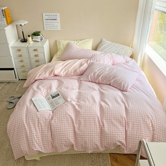 Aerial view of the VibeCore Pastel Pink Plaid Bedding Set, showcasing its soft, pastel plaid design and cozy, inviting vibe—perfect for adding a timeless yet modern touch to your bedroom or dorm.