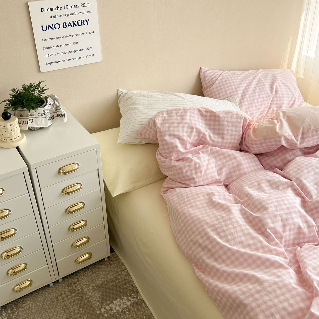 Close-up view of the gingham detailing on the VibeCore Pastel Pink Plaid Bedding Set, showcasing the delicate, timeless plaid design and soft, cozy fabric.