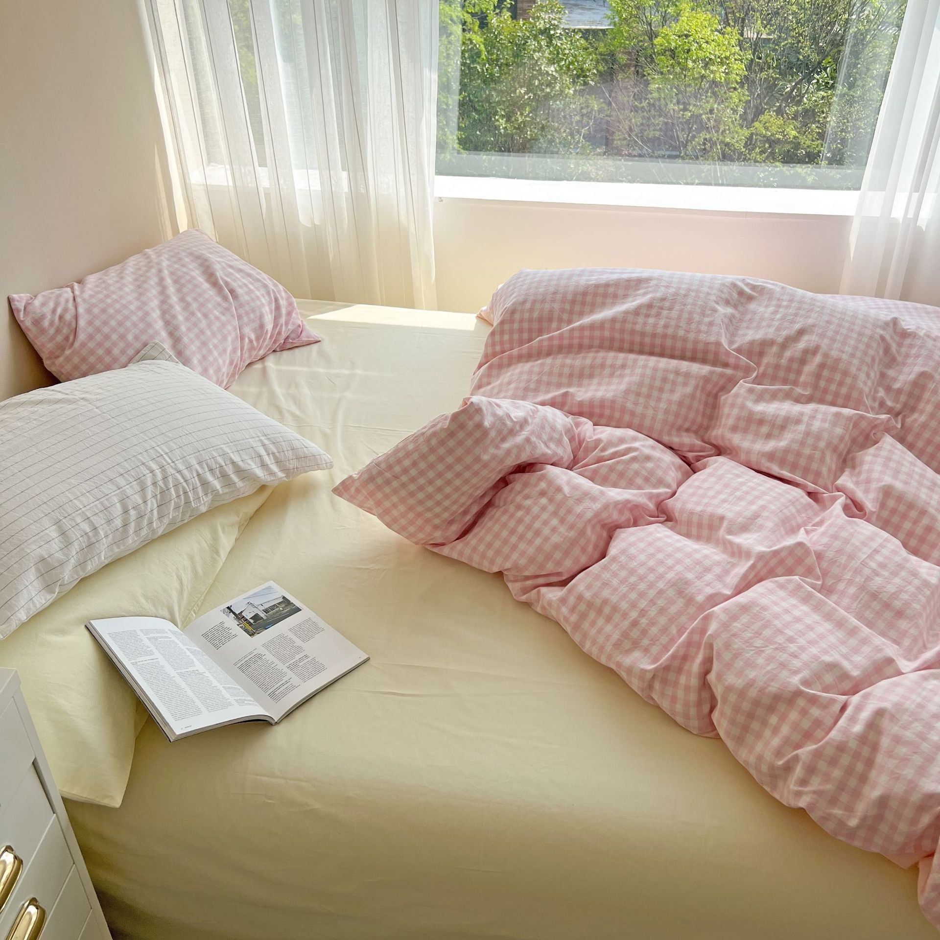 Close-up view of the duvet cover and sheet from the VibeCore Pastel Pink Plaid Bedding Set, highlighting the soft cotton fabric and charming pastel pink plaid pattern.