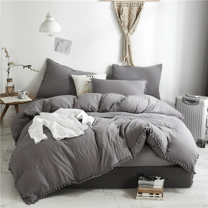 Aerial view of the VibeCore Aesthetic PomPom Duvet Cover Set in light gray, featuring soft pom-pom accents that add a playful and cozy touch. Crafted from soft, breathable fabric, this duvet set brings a fresh, light, and inviting aesthetic to any bedroom or dorm.