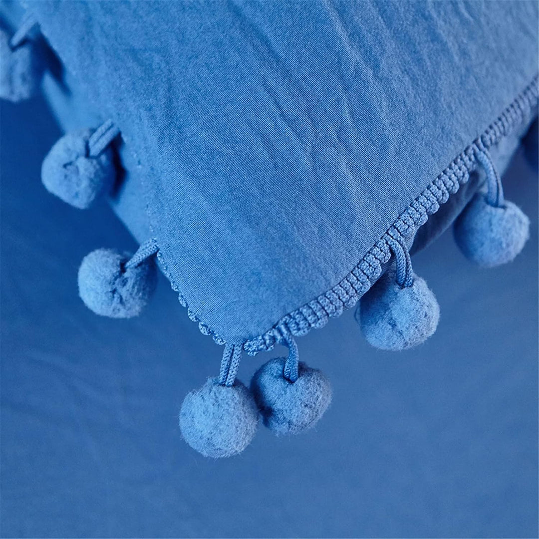 Close-up of the pompom detailing on the VibeCore Aesthetic PomPom Duvet Cover Set in navy blue, showcasing the soft, playful pom-pom accents that add texture and charm. Crafted from soft, breathable fabric, this duvet set brings a cozy, inviting touch to any bedroom or dorm.
