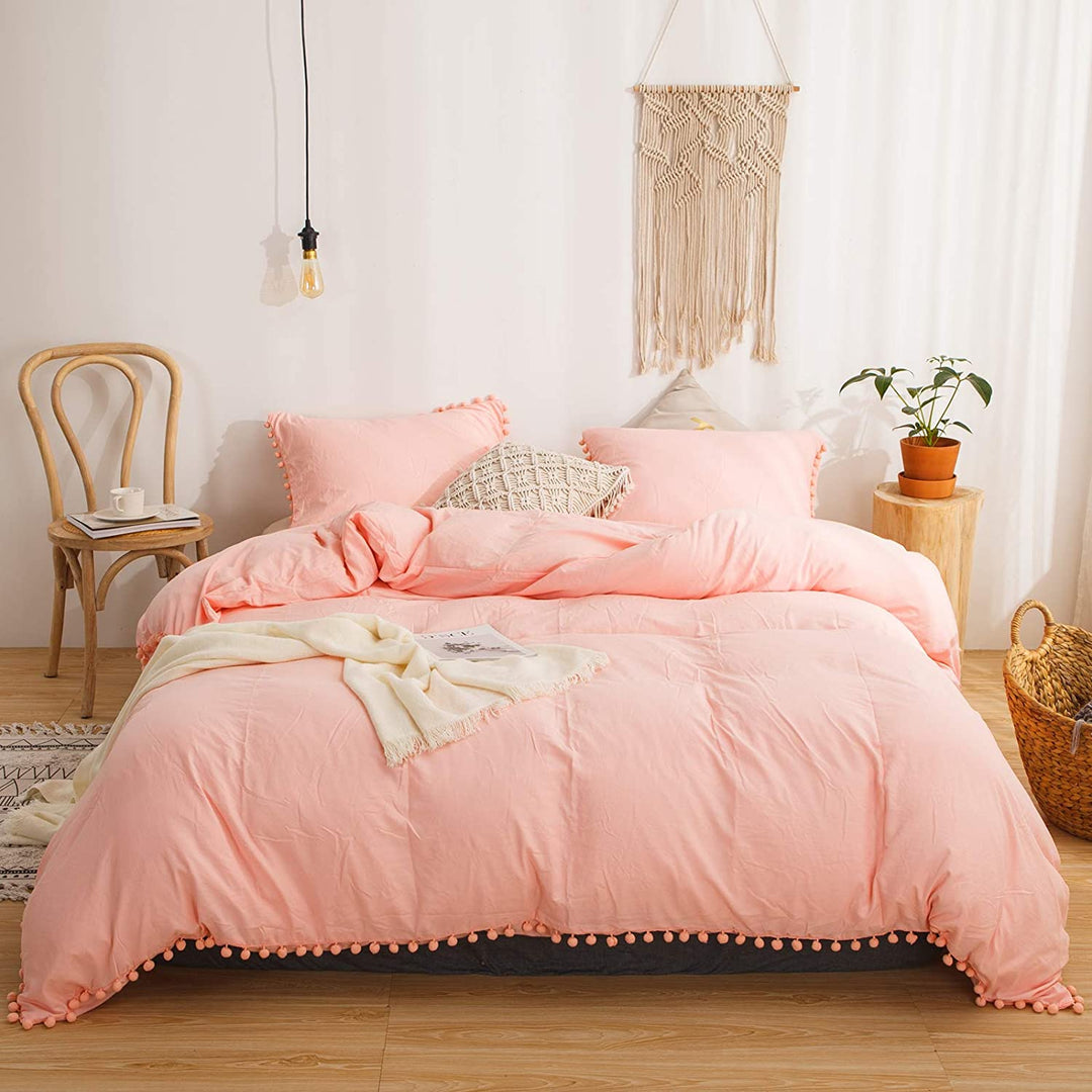 Aerial view of the VibeCore Aesthetic PomPom Duvet Cover Set in rose featuring soft pom-pom accents that add a playful and cozy touch. Crafted from soft, breathable fabric, this duvet set brings a fresh, light, and inviting aesthetic to any bedroom or dorm.