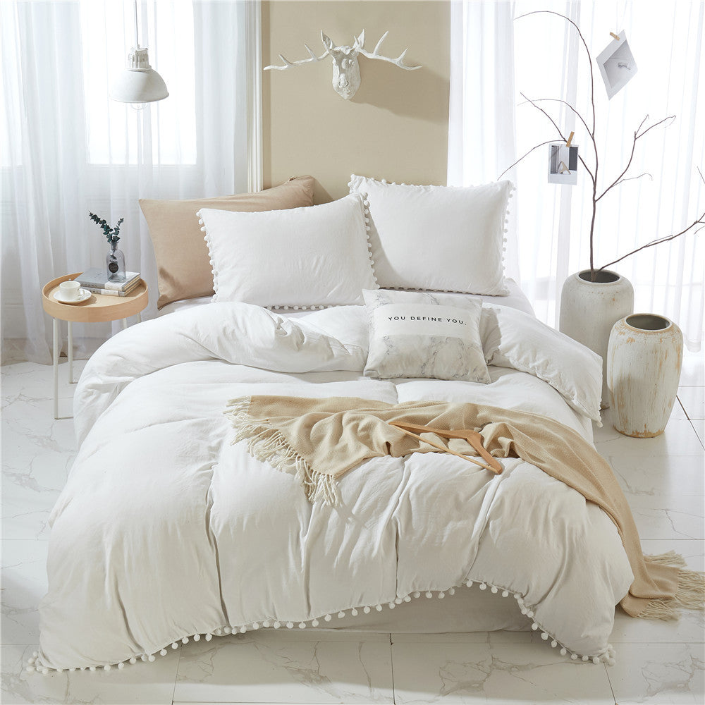 Front view of the VibeCore Aesthetic PomPom Duvet Cover Set in white, showcasing the soft pom-pom accents along the edges. Crafted from breathable, cozy fabric, this duvet set adds a playful and inviting touch to any bedroom or dorm.