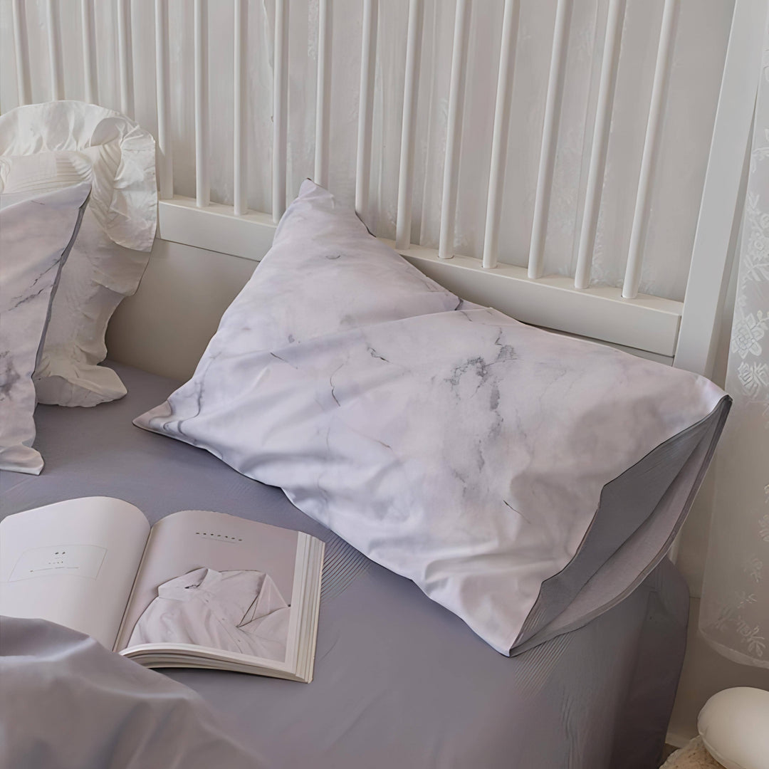 Close-up of the pillowcase from the VibeCore Aesthetic Purple Marble Duvet Cover Set, showcasing the beautiful purple marble design with rich swirls and vibrant tones. Crafted from soft, breathable fabric, this pillowcase brings a luxurious and modern touch to any bedroom or dorm.