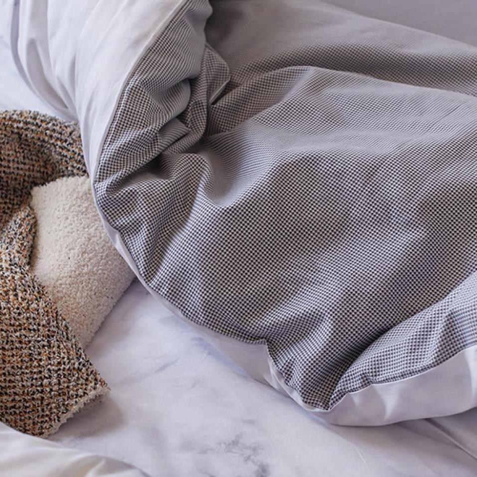 Close-up of the interior of the sheet from the VibeCore Aesthetic Purple Marble Duvet Cover Set, featuring the soft, breathable fabric that enhances comfort. The vibrant purple marble design on the exterior adds a modern, luxurious touch to any bedroom or dorm.