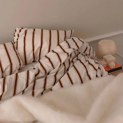 Close-up of the pillow cover and bold red stripe pattern on the VibeCore Red Stripe Bedding Set, highlighting the soft, breathable cotton-polyester fabric. This detailed view showcases the intricate design and vibrant stripes, adding a stylish, cozy touch to your bedroom or dorm decor.