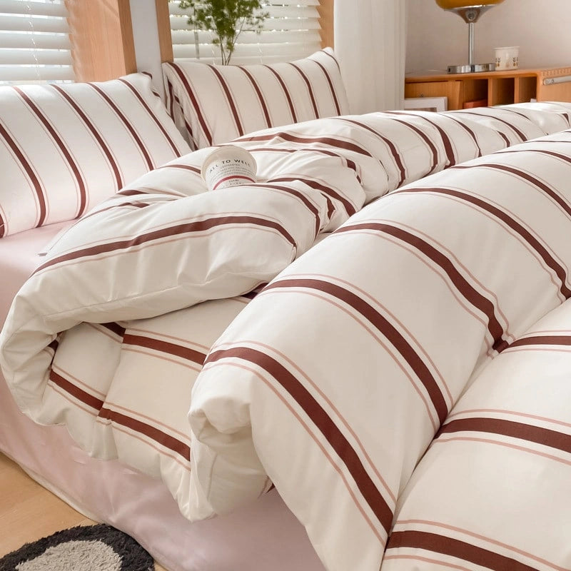 Close-up view of the pattern and duvet cover with comforter of the VibeCore Red Stripe Bedding Set, highlighting the vibrant red stripes and the soft cotton-polyester blend fabric. This image emphasizes the cozy, high-quality materials, making it perfect for adding both style and comfort to your bedroom.