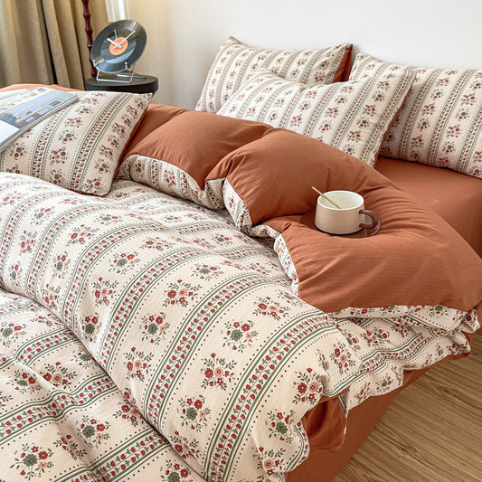 Close-up view of the VibeCore Aesthetic Retro Terracotta Floral Duvet, highlighting the warm terracotta tones and intricate floral design. Made from soft, breathable fabric, this duvet brings a vintage-inspired, cozy vibe to any bedroom or dorm.