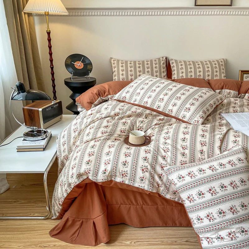 Left front view of the VibeCore Aesthetic Retro Terracotta Floral Duvet, showcasing the rich terracotta hues and detailed floral pattern. Crafted from soft, breathable fabric, this duvet adds a cozy, vintage-inspired touch to any bedroom or dorm decor.