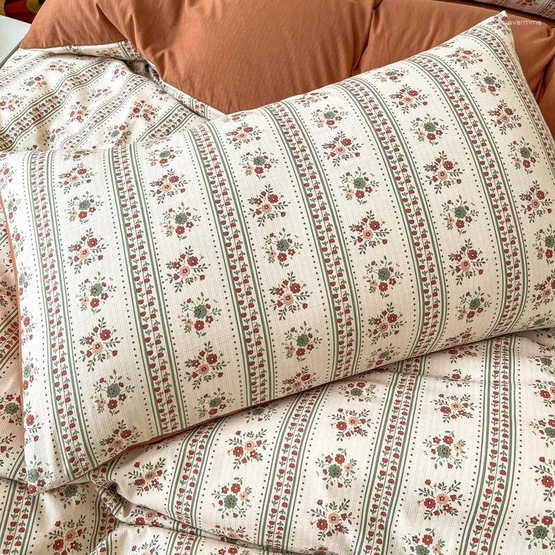 Close-up of the pillowcase from the VibeCore Aesthetic Retro Terracotta Floral Duvet, featuring the same vibrant terracotta tones and detailed floral pattern. Made from soft, breathable fabric, this pillowcase adds a cozy, vintage-inspired touch to any bedroom or dorm.