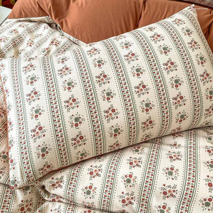 Close-up of the pillowcase from the VibeCore Aesthetic Retro Terracotta Floral Duvet, featuring the same vibrant terracotta tones and detailed floral pattern. Made from soft, breathable fabric, this pillowcase adds a cozy, vintage-inspired touch to any bedroom or dorm.