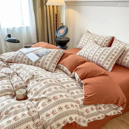 Side view of the VibeCore Aesthetic Retro Terracotta Floral Duvet, highlighting the vibrant terracotta color and intricate floral design. Made from soft, breathable fabric, this duvet brings a cozy, vintage-inspired charm to any bedroom or dorm.