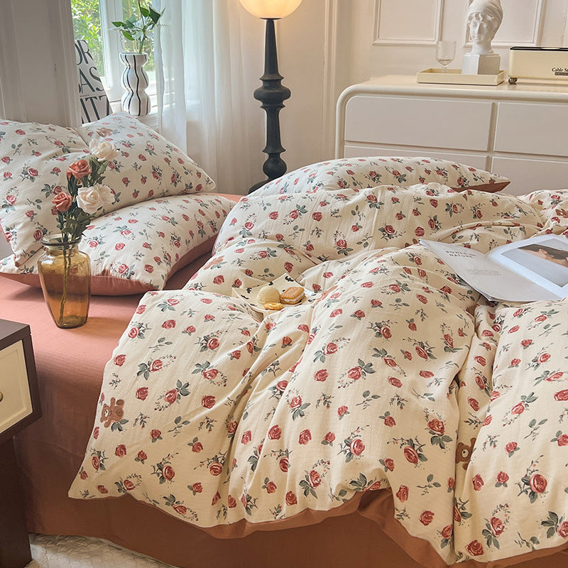 Side view of the VibeCore Aesthetic Rosy Bear Duvet Cover Set, showcasing the cute rosy bear design and soft, breathable fabric. This cozy and playful set adds a fun and charming touch to any bedroom or dorm decor.