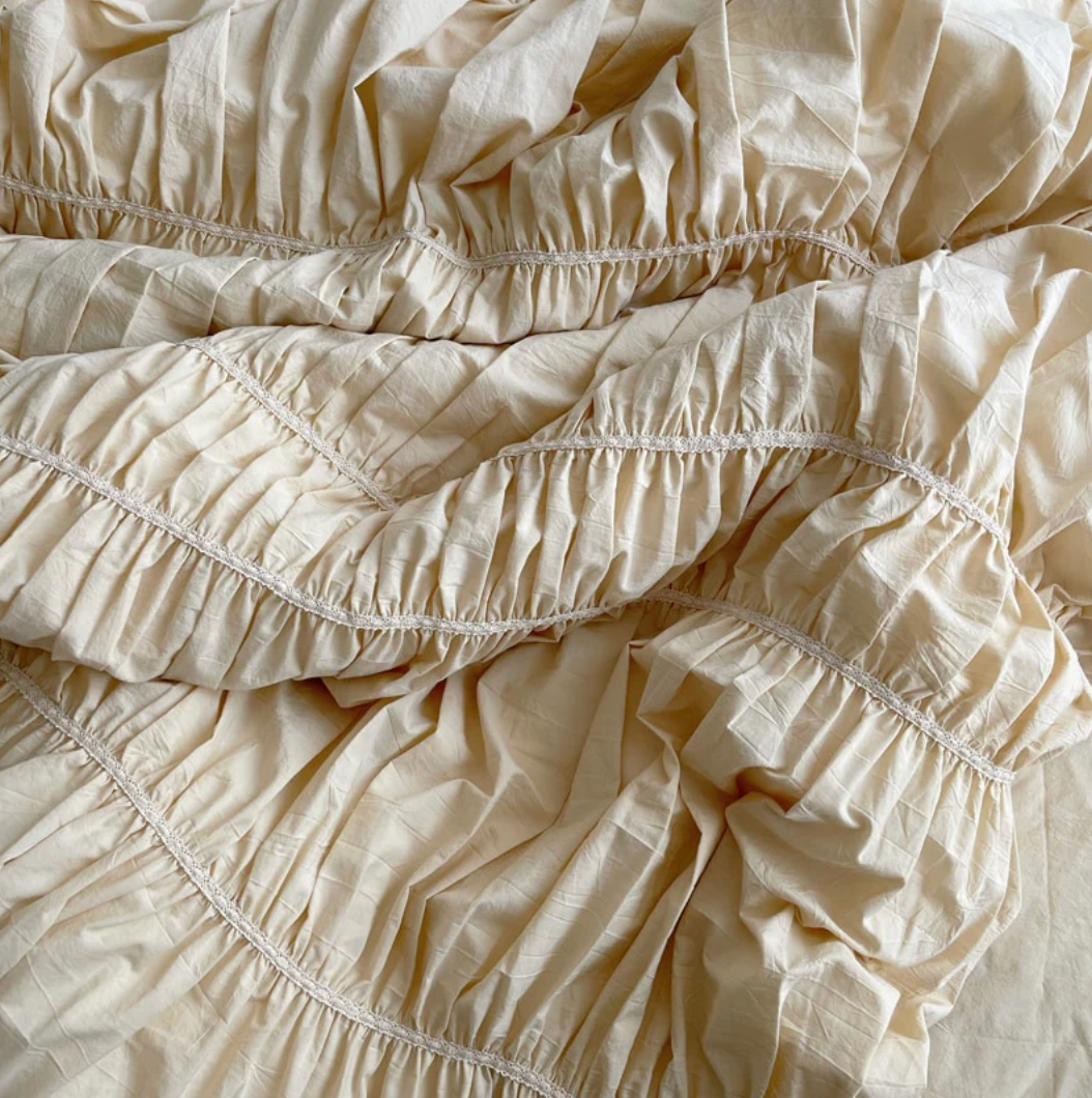 Close-up of the intricate detailing on the VibeCore Royal Pleated Bedding Set, showcasing the soft cotton fabric and elegant pleated accents that elevate its luxurious and romantic aesthetic.