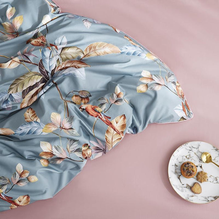 Close-up of the material from the VibeCore Aesthetic Satin Flower Language Duvet Cover, highlighting the smooth, silky satin texture. Crafted from soft, high-quality fabric, this duvet cover offers a luxurious feel and sophisticated floral design, perfect for adding elegance to any bedroom or dorm.