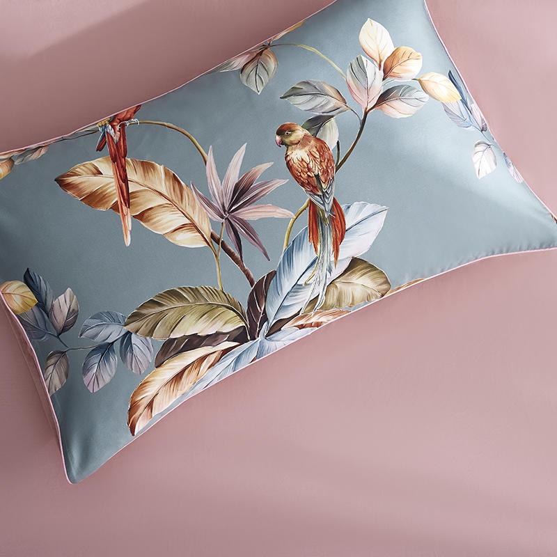 Close-up of the pillowcases from the VibeCore Aesthetic Satin Flower Language Duvet Cover Set, featuring the elegant satin texture and delicate floral design. Made from soft, silky fabric, these pillowcases add a sophisticated and luxurious touch to any bedroom or dorm.