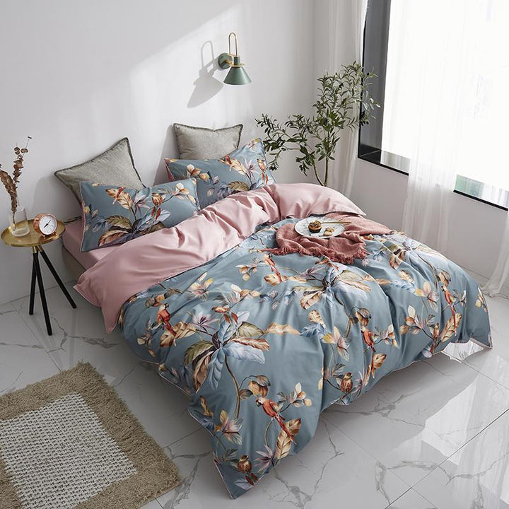Side aerial view of the VibeCore Aesthetic Satin Flower Language Duvet Cover, showcasing the luxurious satin finish and delicate floral pattern. Crafted from soft, silky fabric, this duvet cover adds a sophisticated and elegant touch to any bedroom or dorm decor.
