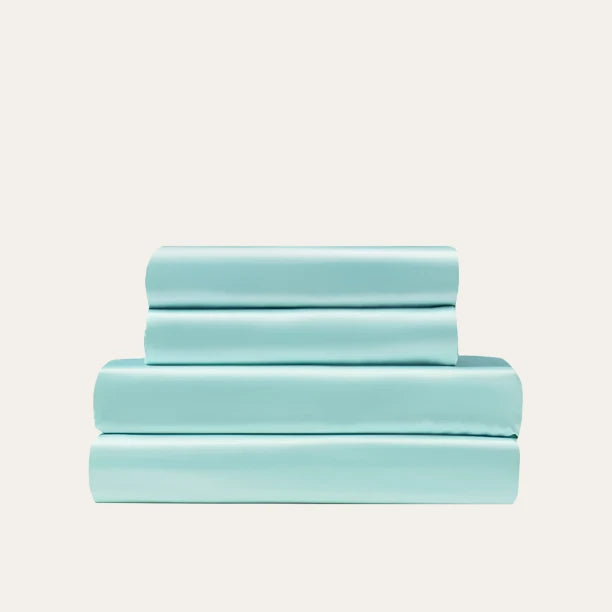 VibeCore Aesthetic Sleek Satin Duvet Cover Set in aqua, showcasing the complete sheet package including duvet cover, flat sheet, and pillowcases, designed for a luxurious and smooth bedroom and dorm experience.
