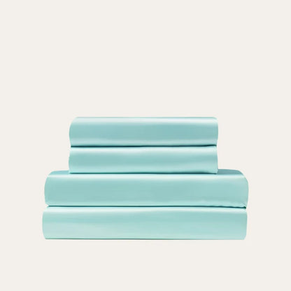 VibeCore Aesthetic Sleek Satin Duvet Cover Set in aqua, showcasing the complete sheet package including duvet cover, flat sheet, and pillowcases, designed for a luxurious and smooth bedroom and dorm experience.
