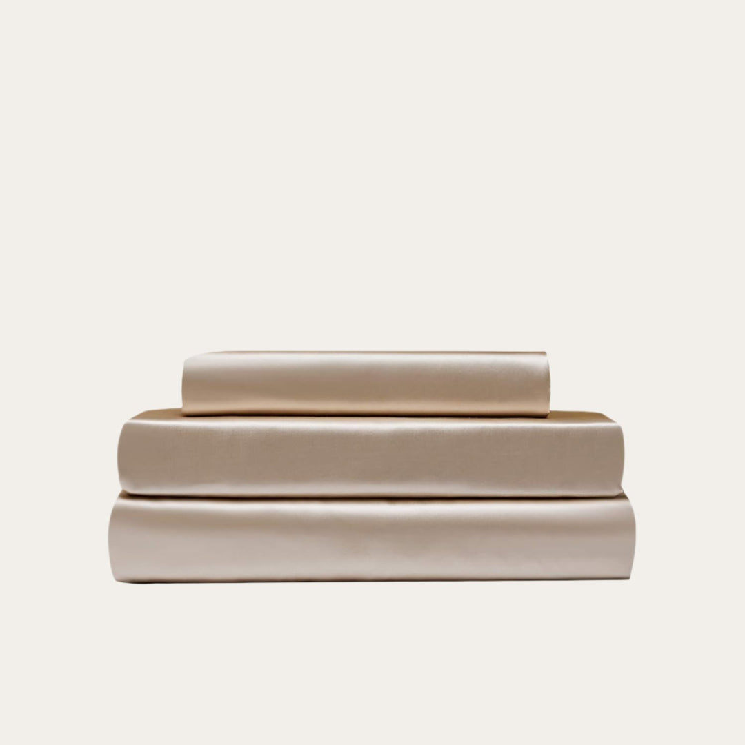 VibeCore Aesthetic Sleek Satin Duvet Cover Set in beige, showcasing the complete sheet package including duvet cover, flat sheet, and pillowcases, designed for a luxurious and smooth bedroom and dorm experience.
