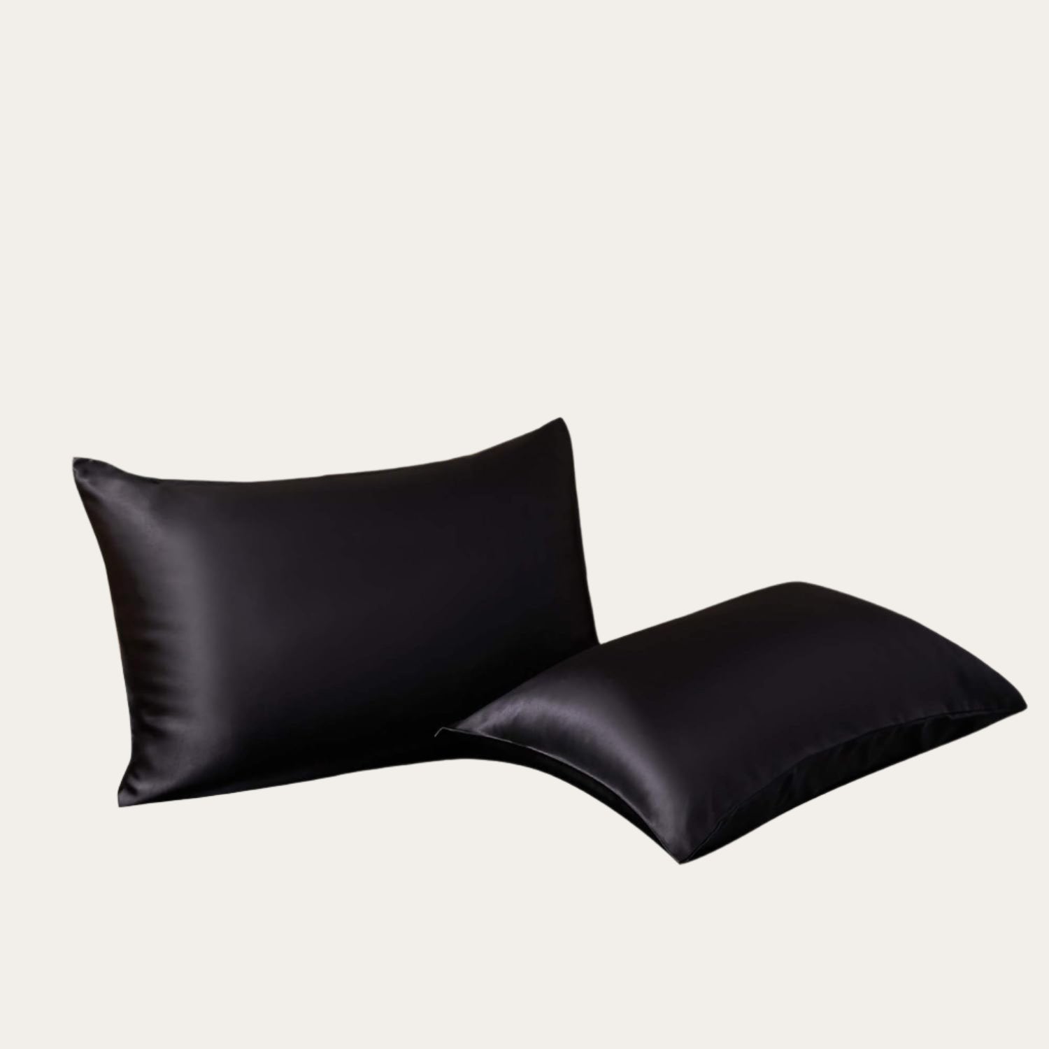 VibeCore Aesthetic Sleek Satin Duvet Cover Set black pillowcases, designed with a smooth, luxurious satin finish to add elegance and comfort to your bedroom or dorm decor.
