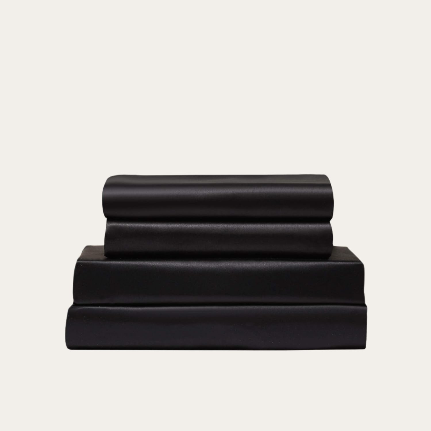 VibeCore Aesthetic Sleek Satin Duvet Cover Set in black, showcasing the complete sheet package including duvet cover, flat sheet, and pillowcases, designed for a luxurious and smooth bedroom and dorm experience.
