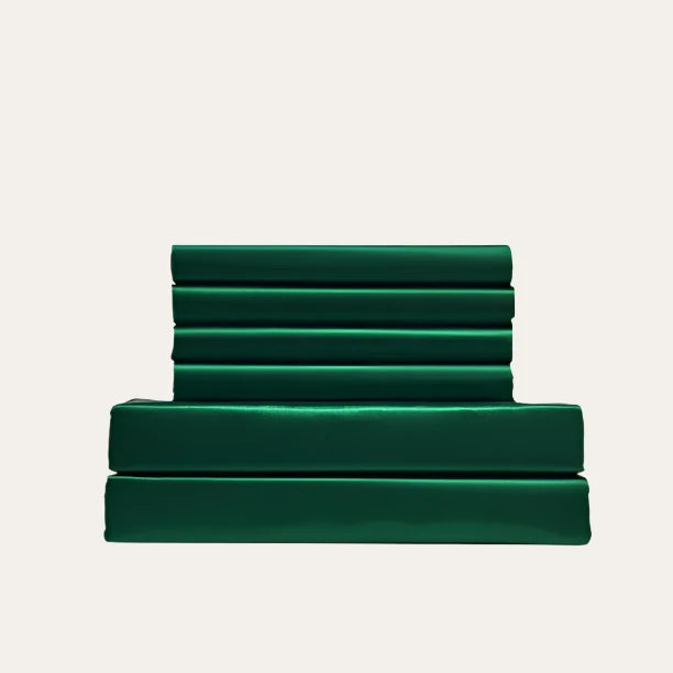VibeCore Aesthetic Sleek Satin Duvet Cover Set in green, showcasing the complete sheet package including duvet cover, flat sheet, and pillowcases, designed for a luxurious and smooth bedroom and dorm experience.