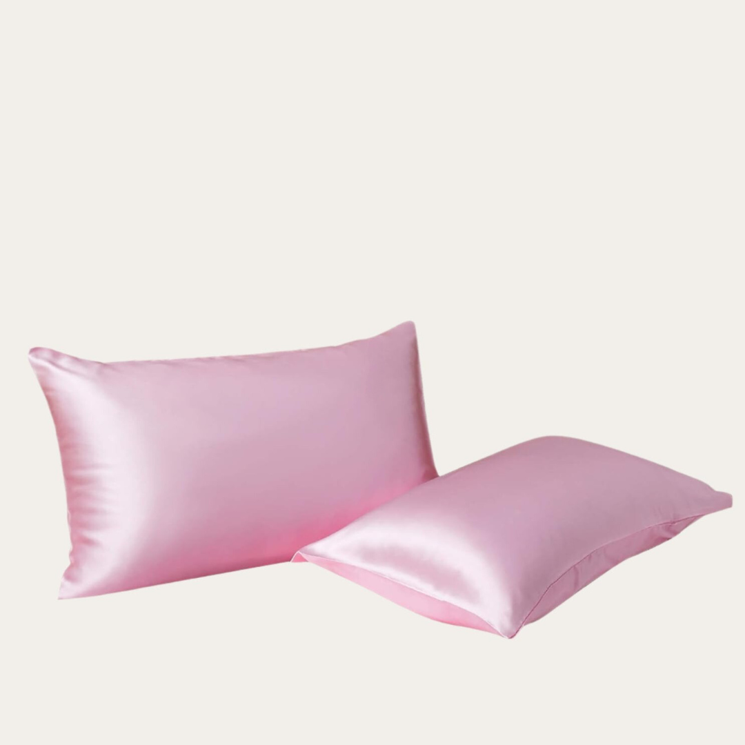 VibeCore Aesthetic Sleek Satin Duvet Cover Set pink pillowcases, designed with a smooth, luxurious satin finish to add elegance and comfort to your bedroom or dorm decor.
