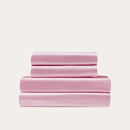 VibeCore Aesthetic Sleek Satin Duvet Cover Set in pink, showcasing the complete sheet package including duvet cover, flat sheet, and pillowcases, designed for a luxurious and smooth bedroom and dorm experience.
