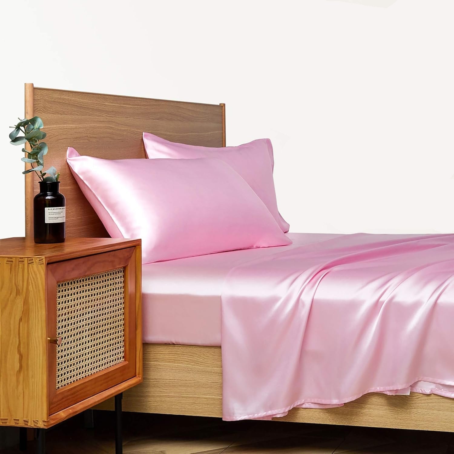 VibeCore Aesthetic Sleek Satin Duvet Cover Set in pink, side view, highlighting the rich satin fabric and smooth texture, adding a touch of elegance to your bedroom or dorm.