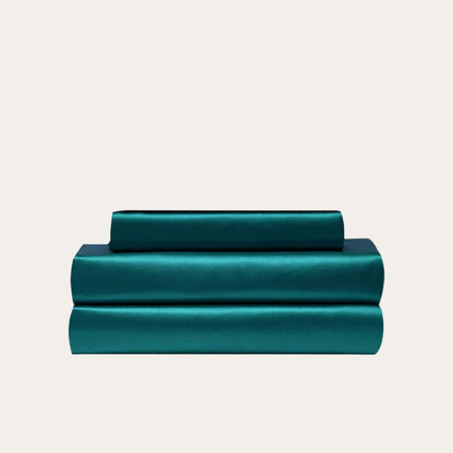 VibeCore Aesthetic Sleek Satin Duvet Cover Set in teal, showcasing the complete sheet package including duvet cover, flat sheet, and pillowcases, designed for a luxurious and smooth bedroom and dorm experience.
