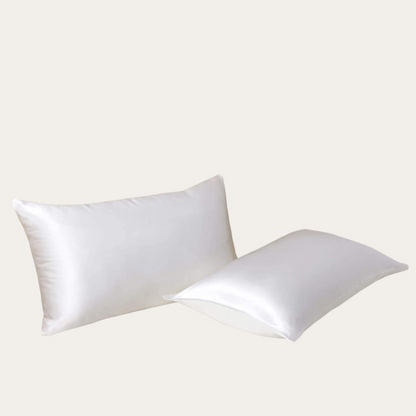 VibeCore Aesthetic Sleek Satin Duvet Cover Set white pillowcases, designed with a smooth, luxurious satin finish to add elegance and comfort to your bedroom or dorm decor.