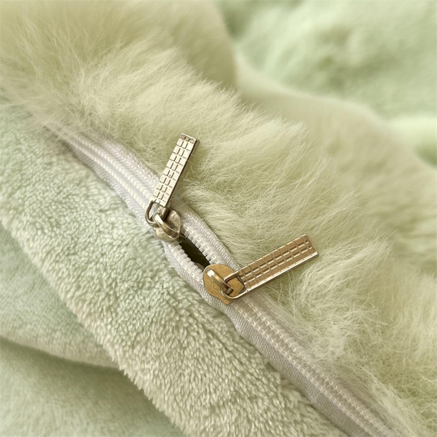 Close-up of the zipper on the VibeCore Snuggle Supreme Bedding Set in color Matcha Green, showcasing the durable, high-quality zipper for easy use and a seamless look.