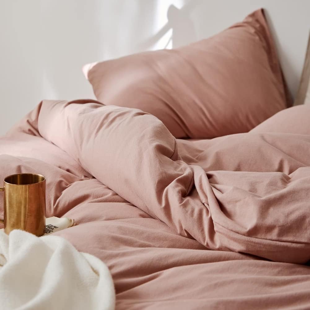 Close-up of the VibeCore Aesthetic Solid Comfort Duvet Cover Set in Baby Pink, highlighting the soft, luxurious texture and subtle pink color, perfect for creating a cozy, inviting atmosphere in any room.