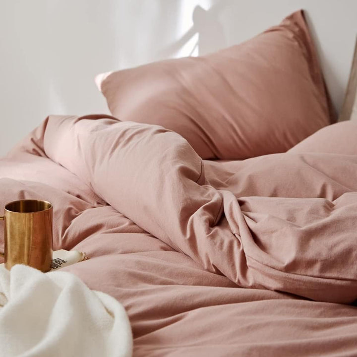 Close-up of the VibeCore Aesthetic Solid Comfort Duvet Cover Set in Baby Pink, highlighting the soft, luxurious texture and subtle pink color, perfect for creating a cozy, inviting atmosphere in any room.
