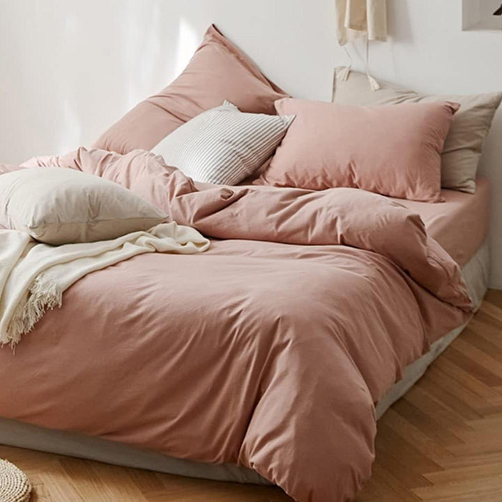 Front right view of the VibeCore Aesthetic Solid Comfort Duvet Cover Set in Baby Pink, showcasing its smooth fabric and soft, inviting color that adds a calm and cozy vibe to your bedroom or dorm.