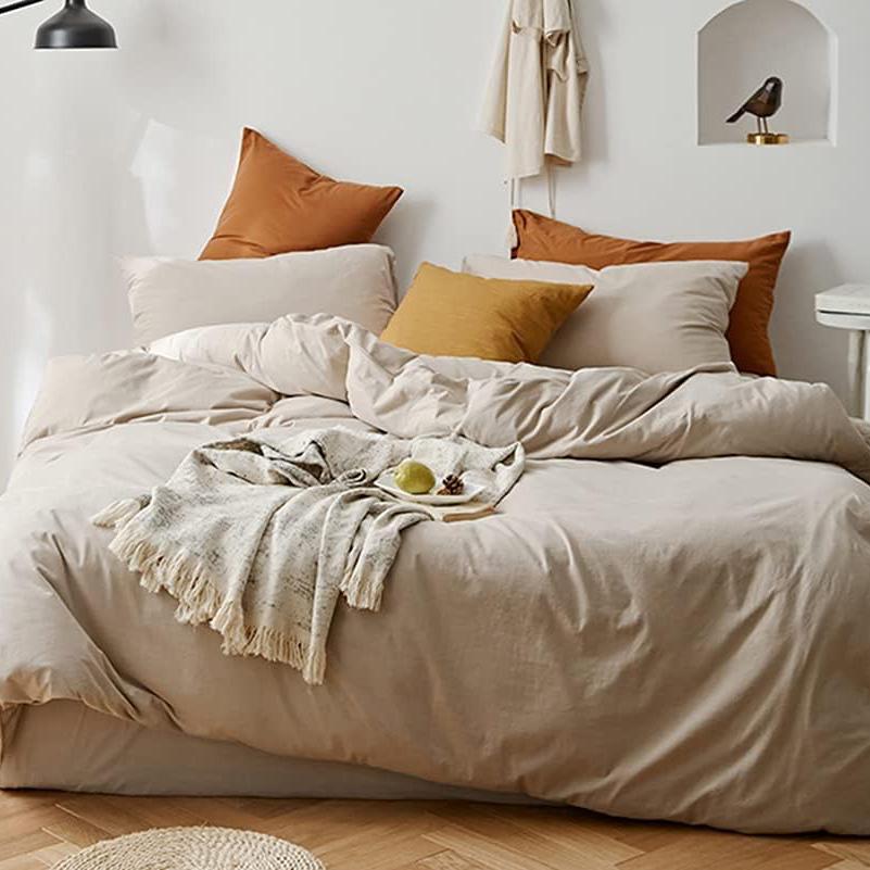 Aerial view of the VibeCore Aesthetic Solid Comfort Duvet Cover Set in Beige, highlighting its sleek, minimalist design and rich color that transforms your bedroom into a cozy retreat.
