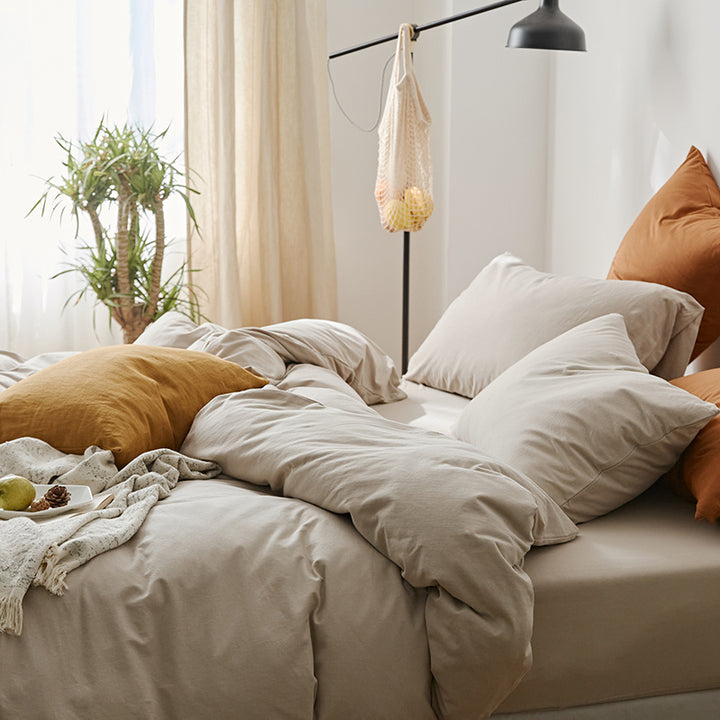 Side view of the VibeCore Aesthetic Solid Comfort Duvet Cover Set in Beige, highlighting its clean lines and cozy, neutral-toned design for a timeless aesthetic.