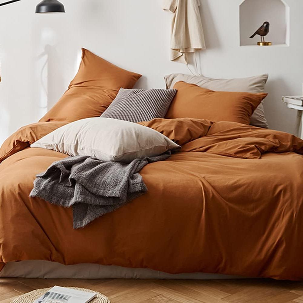 Aerial view of the VibeCore Aesthetic Solid Comfort Duvet Cover Set in Burnt Orange, highlighting its sleek, minimalist design and rich color that transforms your bedroom into a cozy retreat.