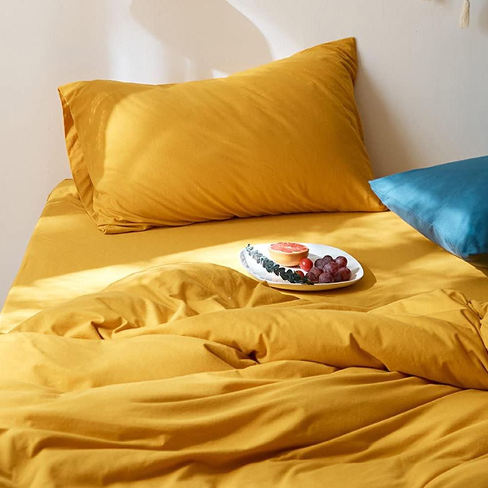 The "VibeCore Aesthetic Solid Comfort Duvet Cover Set in Mustard Yellow" Pillowcase adds a cozy and vibrant touch to your bedroom. With its soft, breathable fabric and rich mustard yellow color, it perfectly complements your duvet cover, bringing a warm, inviting atmosphere to your space. Ideal for both relaxation and style, this pillowcase offers a luxurious, comfortable experience while enhancing your room's aesthetic with its bold, cheerful hue.
