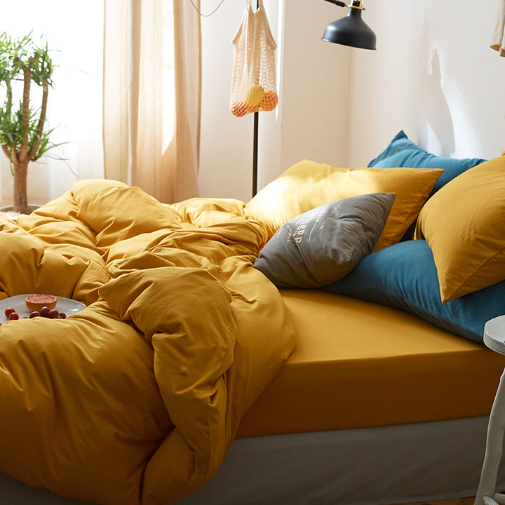 The "VibeCore Aesthetic Solid Comfort Duvet Cover Set in Mustard Yellow" brings a warm, cheerful vibe to your space. The rich mustard yellow hue adds a pop of color while maintaining a soothing, cozy feel. Crafted from soft, breathable fabric, this duvet cover set ensures a comfortable sleep experience while elevating your room's aesthetic. Whether you're going for a bold, vibrant look or pairing it with neutral tones, this duvet cover set offers the perfect balance of style and comfort.