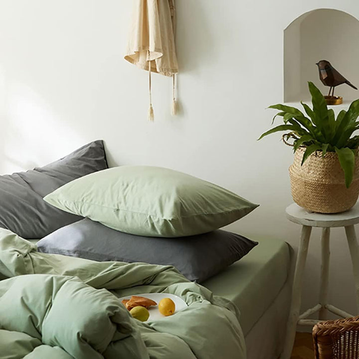 Close-up front right view of the VibeCore Aesthetic Solid Comfort Duvet Cover Set in Sage, highlighting its premium stitching and luxuriously smooth texture for a serene and stylish sleep space.