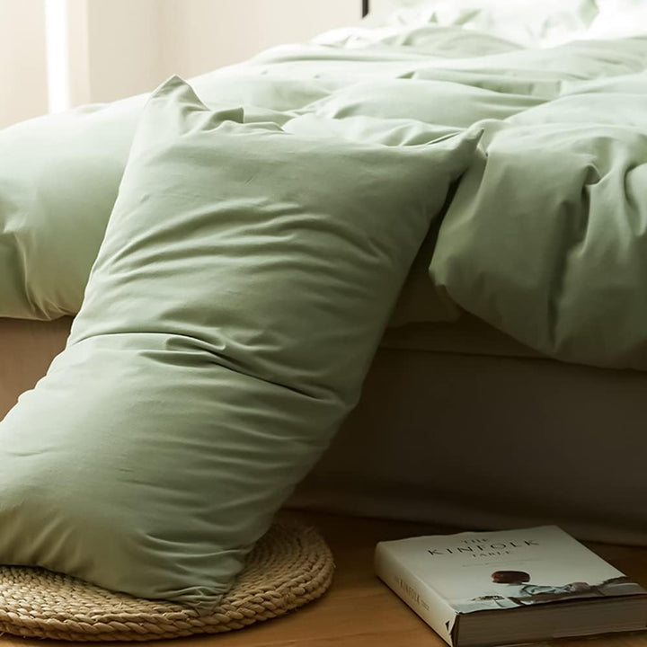 Detailed view of the pillowcase from the VibeCore Aesthetic Solid Comfort Duvet Cover Set in Sage, showcasing its soft, breathable fabric and minimalist elegance.