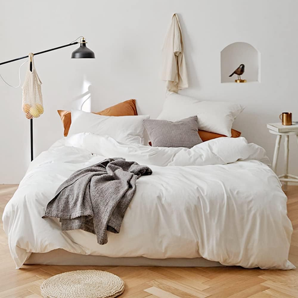 The "VibeCore Aesthetic Solid Comfort Duvet Cover Set in White" captures the perfect balance of simplicity and elegance. With its smooth, crisp texture and minimalist design, it brings a serene and calming vibe to your room. The neutral white tone makes it an easy addition to any aesthetic, offering versatility and comfort for a restful space.
