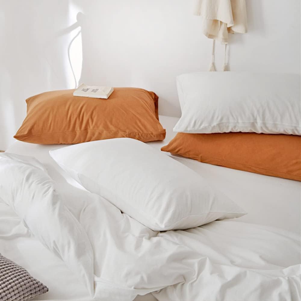 The "VibeCore Aesthetic Solid Comfort Duvet Cover Set in White Pillowcase" is crafted for both style and comfort. Its soft, smooth fabric adds a touch of luxury to your sleep experience, while the minimalist white design complements any room decor. Perfect for those who love clean lines and a peaceful, serene aesthetic, this pillowcase offers cozy, breathable comfort for a restful night’s sleep.