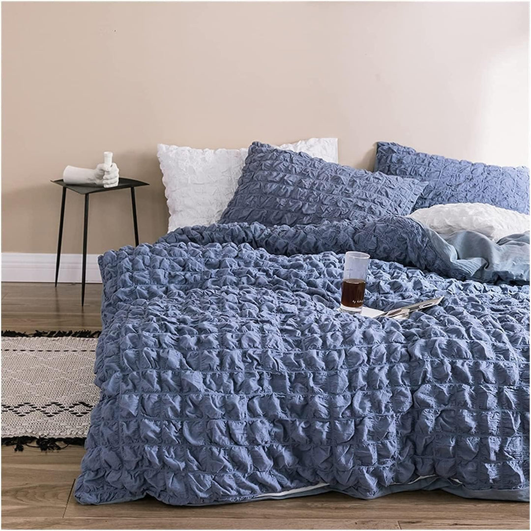 Elevate your space with the VibeCore Aesthetic Tufted Duvet Cover Set in blue. From the front left view, the delicate tufted details create a soft, inviting texture that adds elegance and warmth to your room. The muted rose tone enhances the cozy, sophisticated feel, making it a perfect addition to any modern bedroom.
