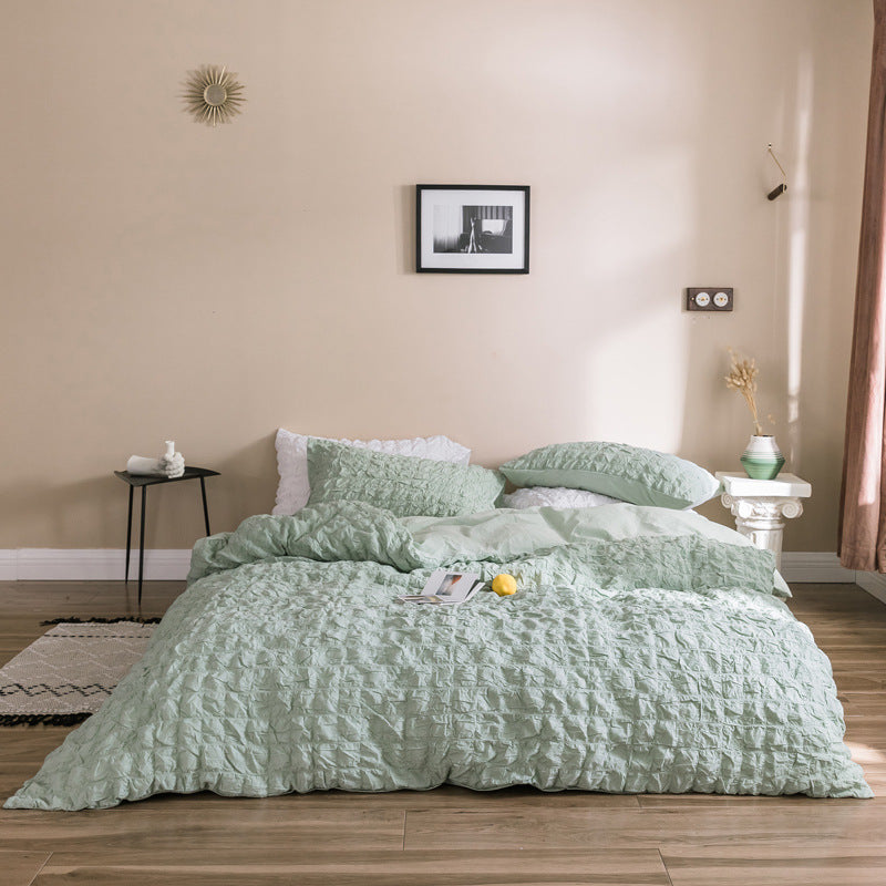 Add a soft, luxurious touch to your bedroom with the VibeCore Aesthetic Tufted Duvet Cover Set in pastel green. Featuring a plush tufted design, this duvet offers a cozy yet stylish look. The aerial view captures the intricate pattern, highlighting the texture and warmth of the premium fabric. Perfect for a serene, chic ambiance.
