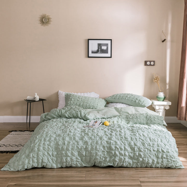 Add a soft, luxurious touch to your bedroom with the VibeCore Aesthetic Tufted Duvet Cover Set in pastel green. Featuring a plush tufted design, this duvet offers a cozy yet stylish look. The aerial view captures the intricate pattern, highlighting the texture and warmth of the premium fabric. Perfect for a serene, chic ambiance.
