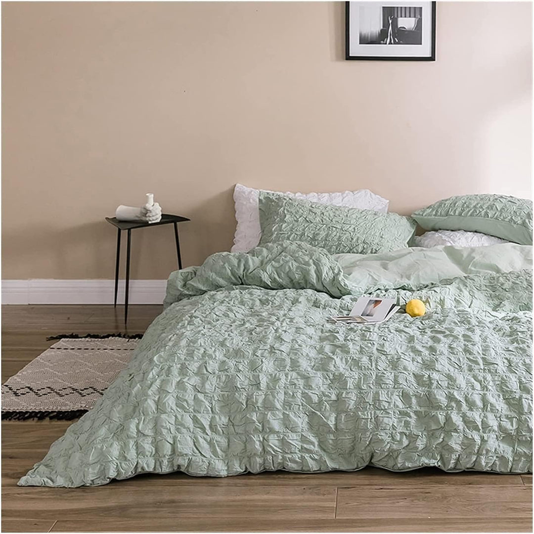 Elevate your space with the VibeCore Aesthetic Tufted Duvet Cover Set in pastel green. From the front left view, the delicate tufted details create a soft, inviting texture that adds elegance and warmth to your room. The muted rose tone enhances the cozy, sophisticated feel, making it a perfect addition to any modern bedroom.
